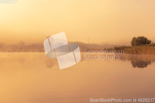 Image of orange light of sunset over the lake