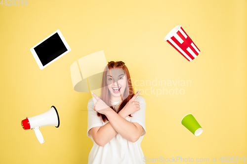 Image of Caucasian young woman\'s portrait on yellow background, too much tasks