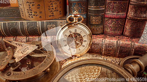 Image of Vintage pocket watch. Vintage background Concept of time history