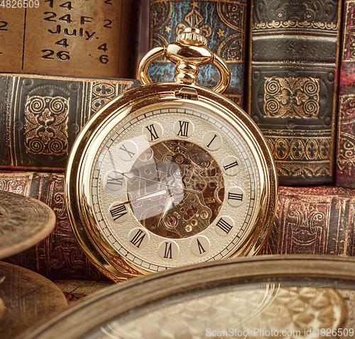 Image of Vintage pocket watch. Vintage background Concept of time history