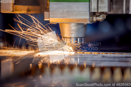 Image of CNC Laser cutting of metal, modern industrial technology.