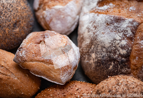 Image of Freshly baked natural bread is on the kitchen table.