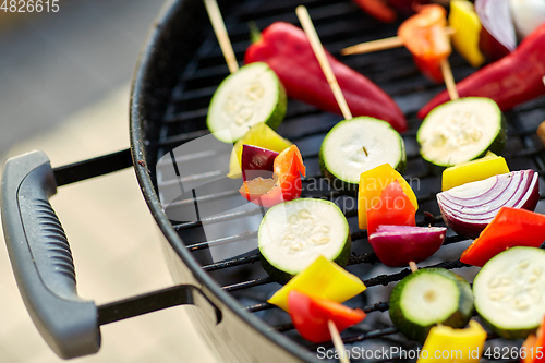 Image of close up of vegetables roasting on brazier grill