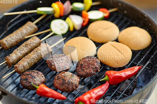 Image of barbecue kebab meat and vegetables on grill