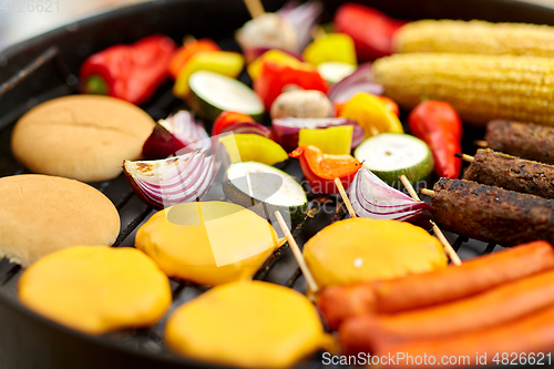 Image of barbecue kebab meat and vegetables on grill