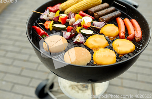 Image of barbecue kebab meat and vegetables on grill