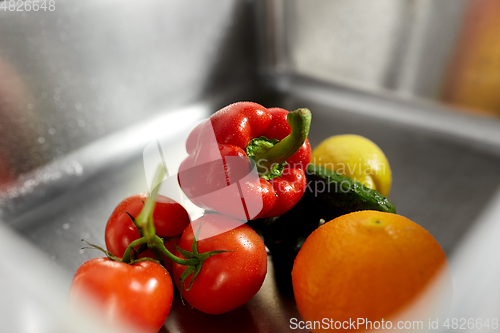 Image of close up of fruits and vegetables in kitchen sink
