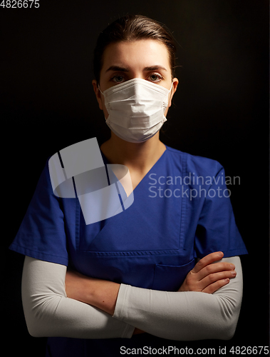 Image of female doctor or nurse in medical face mask