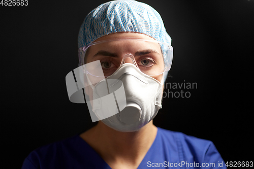 Image of doctor in goggles and protective face mask