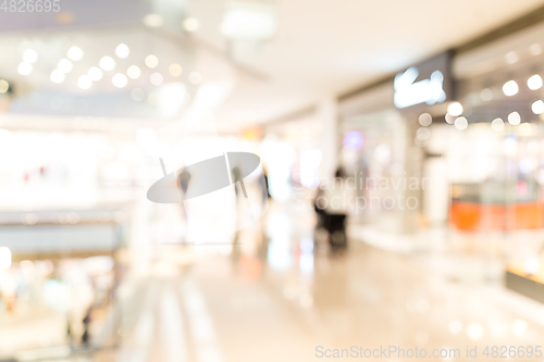 Image of Blurred image of people in shopping mall with bokeh