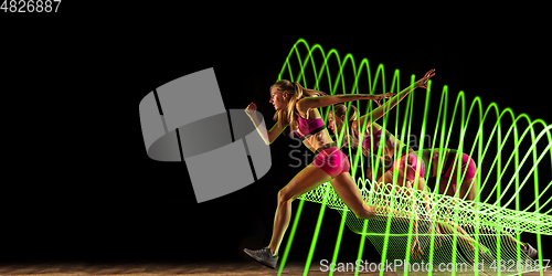 Image of Creative sport and neon waves on dark neon lighted line background