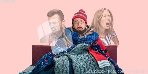 Image of Man feeling ill, has virus infection, fever, headache and sneezing