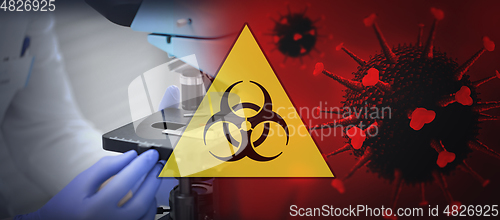 Image of close up of hand with microscope and coronavirus