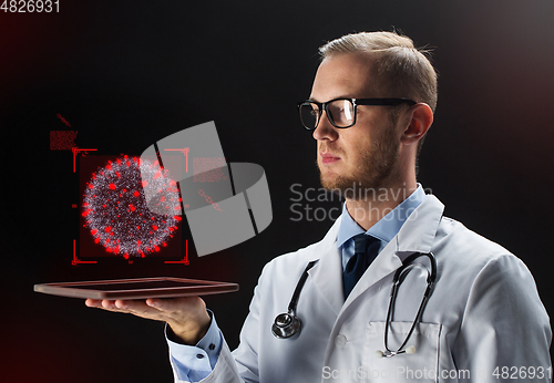 Image of doctor with tablet pc and coronavirus projection