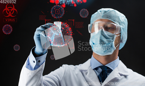 Image of close up of scientist and coronavirus hologram