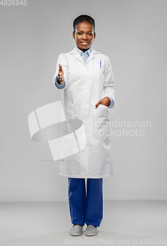 Image of african american female doctor showing thumbs up