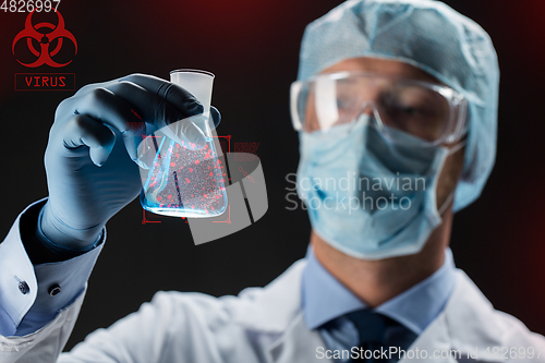 Image of close up of scientist and coronavirus hologram