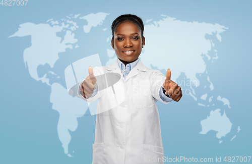 Image of african american female doctor showing thumbs up