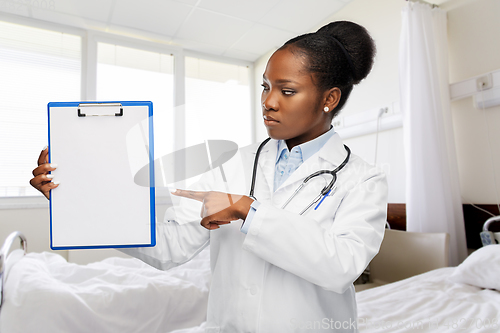 Image of african american doctor with clipboard at hospital