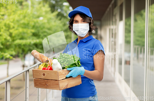 Image of delivery woman in face mask with food in box