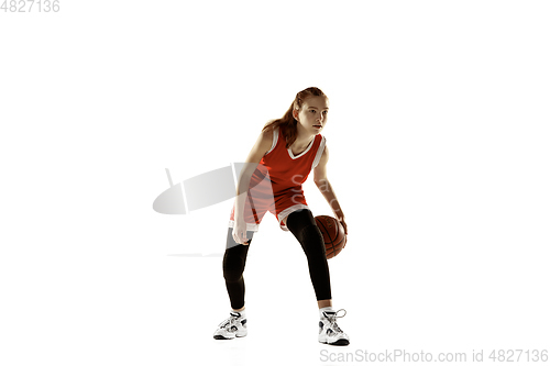 Image of Young caucasian female basketball player against white studio background