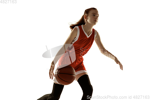 Image of Young caucasian female basketball player against white studio background