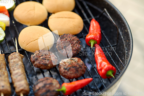 Image of barbecue kebab meat and vegetables on grill