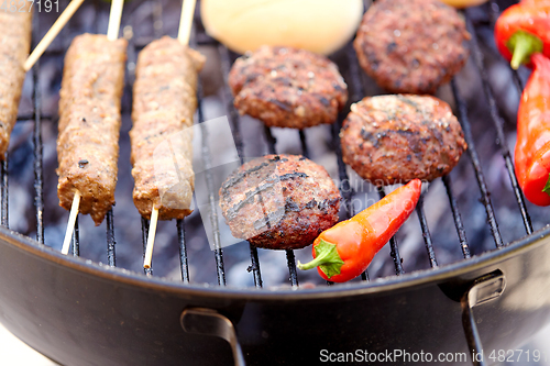 Image of barbecue kebab meat and vegetables on grill