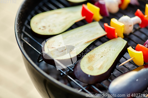 Image of vegetables and mushrooms roasting on brazier grill