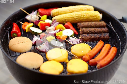 Image of barbecue kebab meat and vegetables on grill