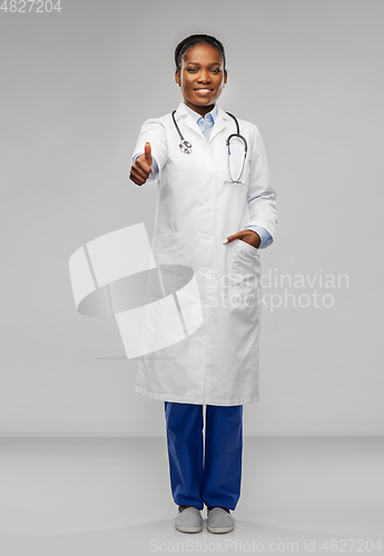 Image of african american female doctor showing thumbs up