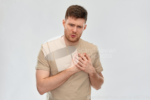 Image of unhappy young man suffering from heartache