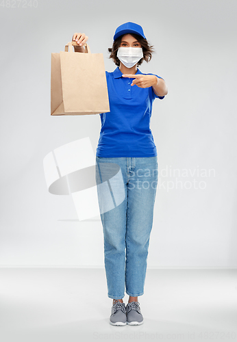 Image of delivery woman in face mask with food in paper bag