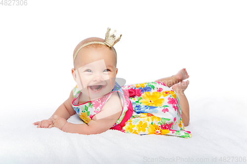 Image of happy beautiful baby girl with crown on head