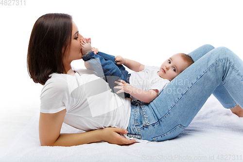 Image of beautiful young mother with toddler baby boy