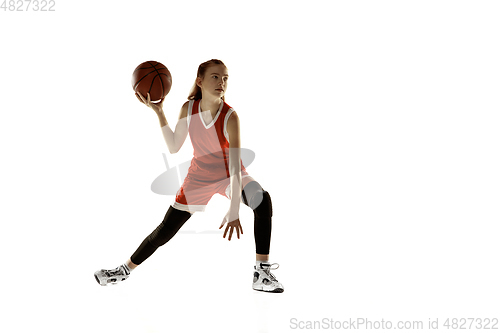 Image of Young caucasian female basketball player against white studio background