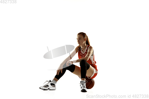 Image of Young caucasian female basketball player against white studio background