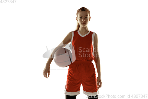 Image of Young caucasian female basketball player against white studio background