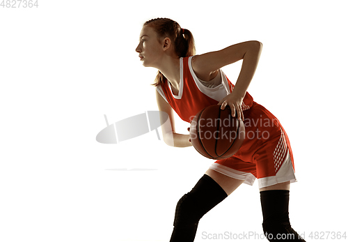 Image of Young caucasian female basketball player against white studio background