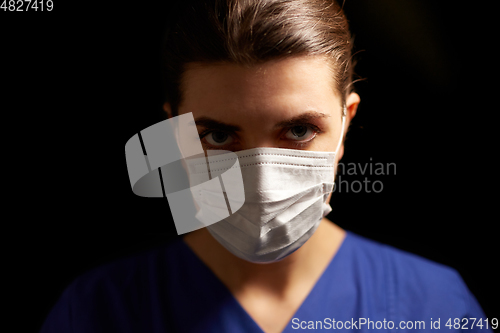 Image of female doctor or nurse in medical face mask