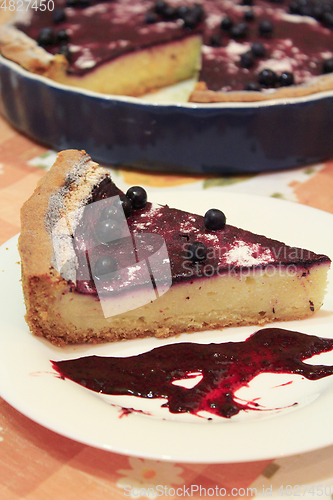 Image of Piece of pie with bilberry on the plate