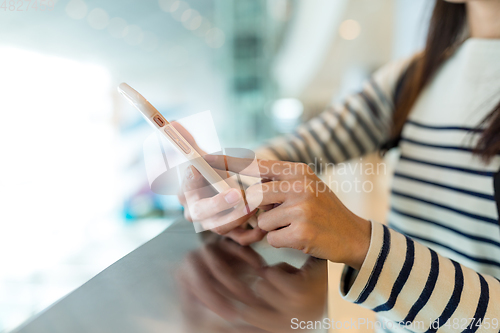 Image of Woman working on smart phone
