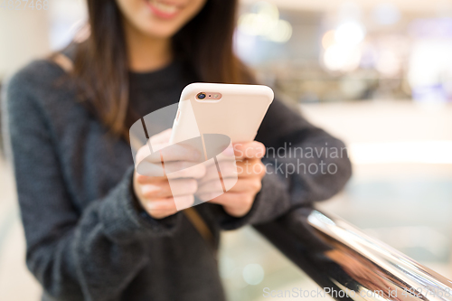 Image of Woman working on mobile phone