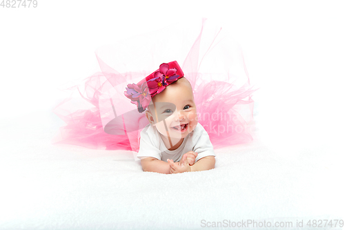 Image of happy beautiful baby girl with pink hat on head