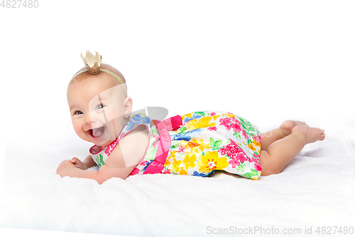 Image of happy beautiful baby girl with crown on head