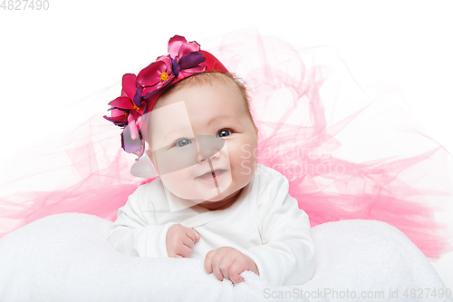 Image of happy beautiful baby girl in tutu skirt and hat