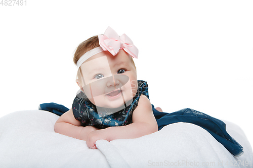 Image of happy beautiful baby girl with bow headband