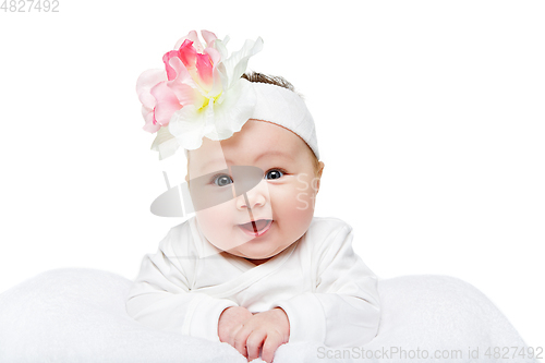 Image of happy beautiful baby girl with flower headband