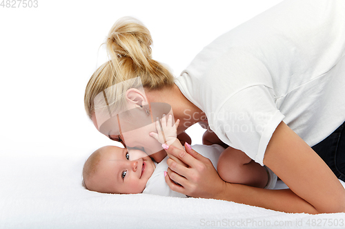 Image of beautiful young mother with toddler baby girl