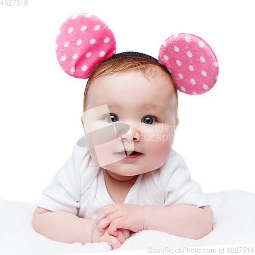 Image of funny little baby girl in mouse ears headband